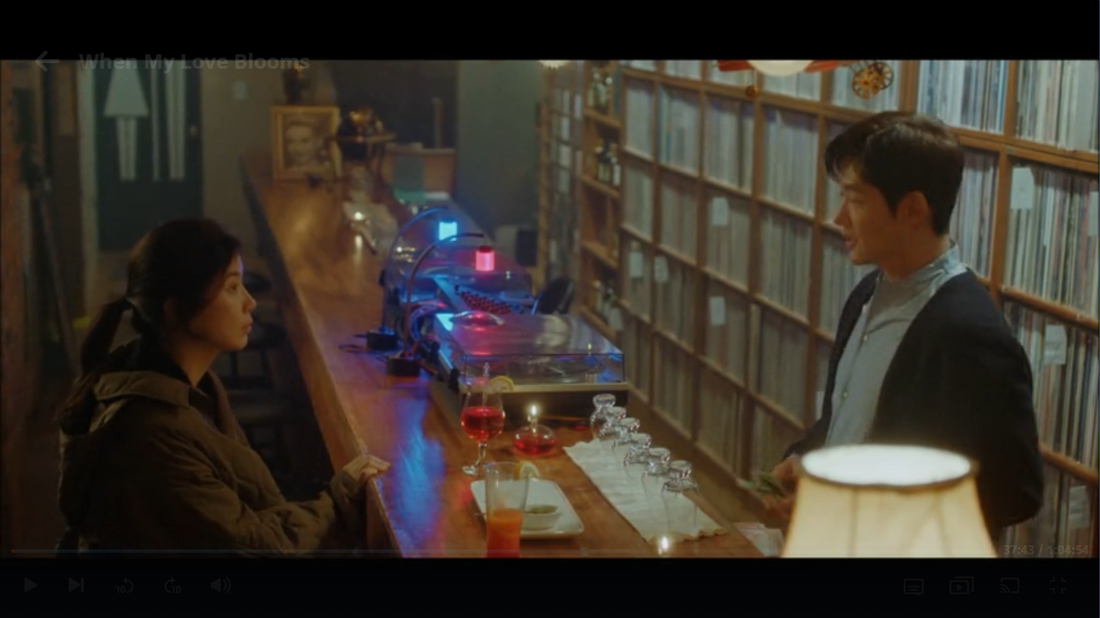 When My Love Blooms Episode 2 Yoon Ji-soo and Joo Young-woo drinking in LP Music Cafe